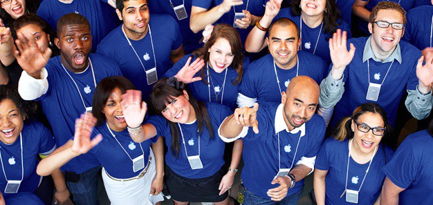 A photo of Apple Store employees wearing blue shirts. The tips and sample Apple interview questions in this story will show you how to get a job at Apple.