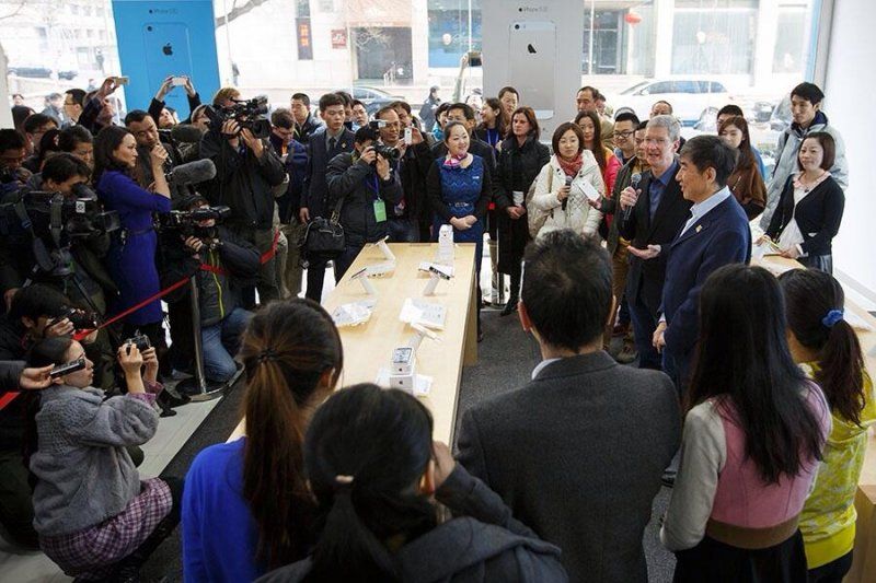 Tim Cook sharing a moment with the crowd at the launch of Apple's partnership with China Mobile.