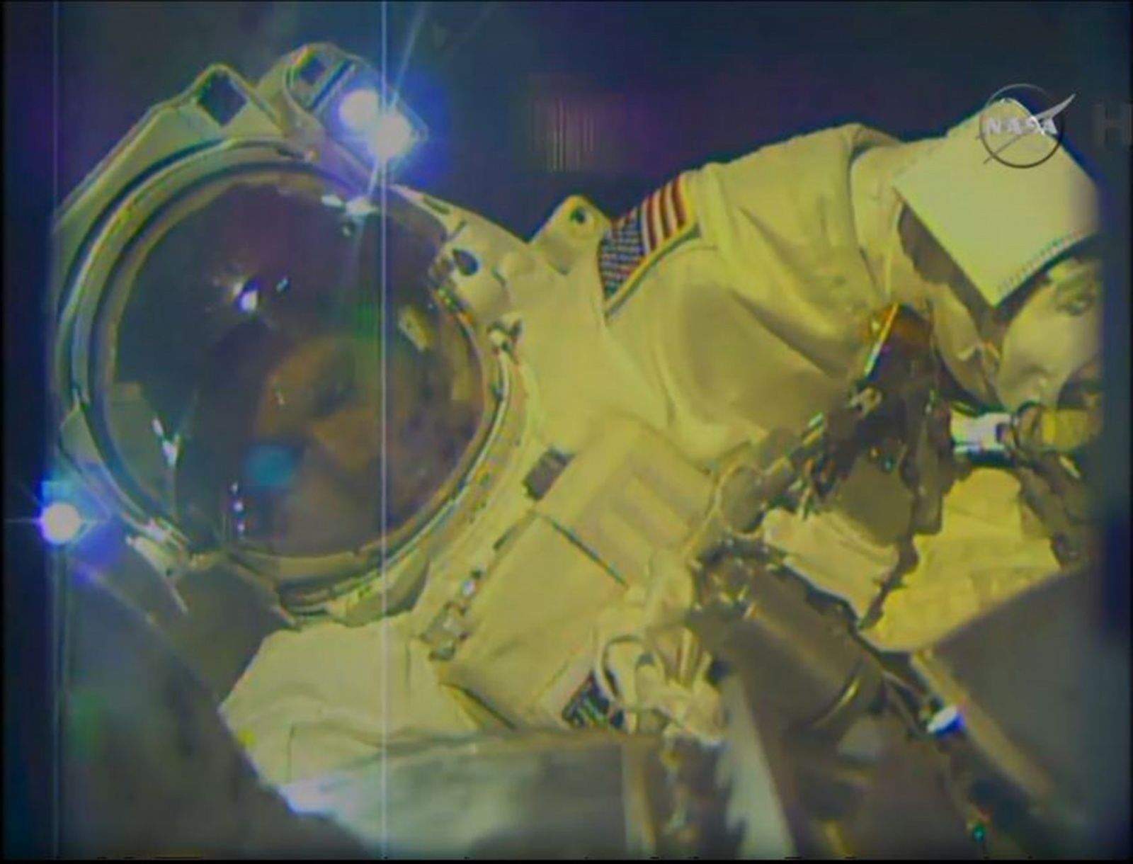 Astronaut Terry Virts as he works on a robotic arm outside the International Space Station Wednesday. Photo: NASA
