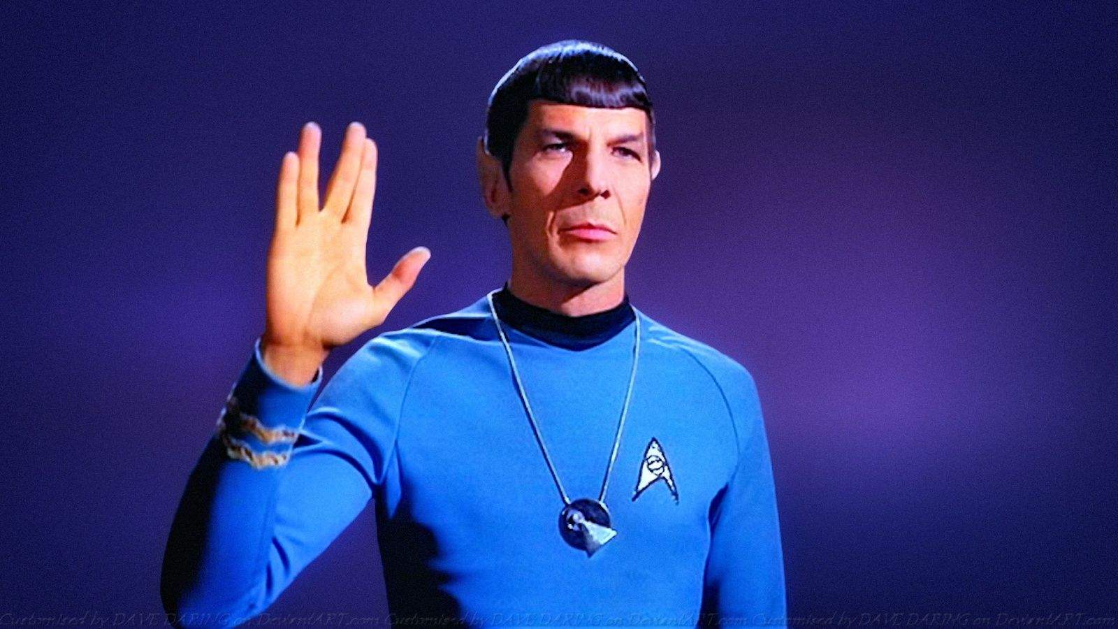 A photo of actor Leonard Nimoy playing the role of Spock in Star Trek, with his right hand raised in the Vulcan salute that is represented in the Spock emoji.