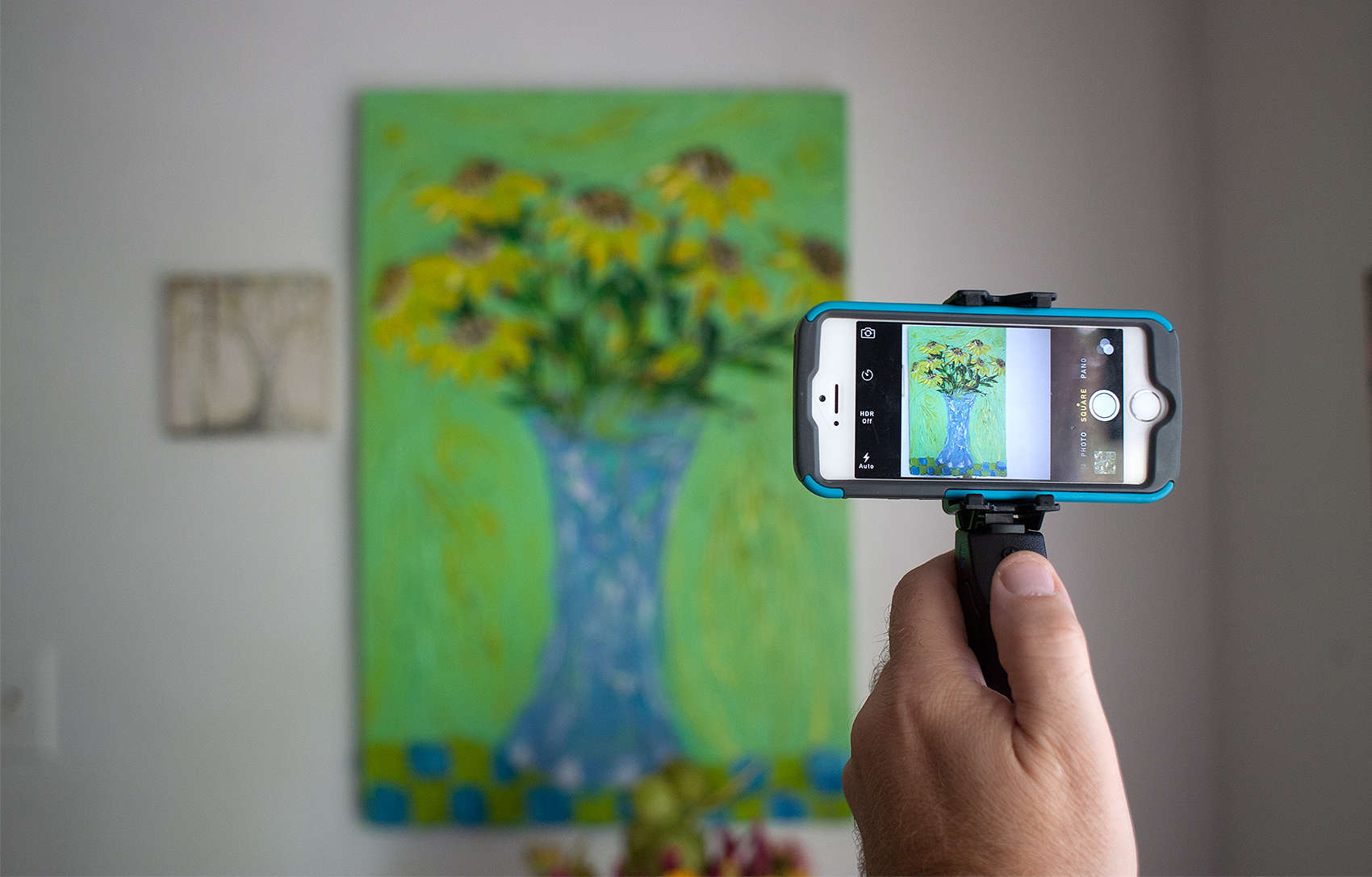 The Grip&Shoot steadies a smartphone photographer's shaky hand.
