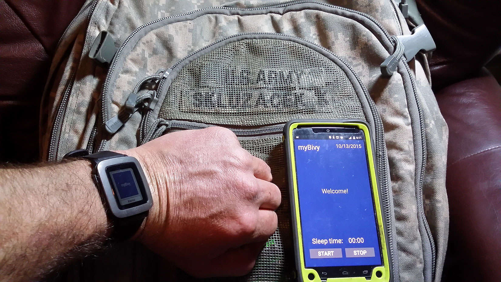Patrick Skluzacek, an Iraq war veteran who suffers from PTSD, shows off the app that is helping him sleep. It was developed by his son.