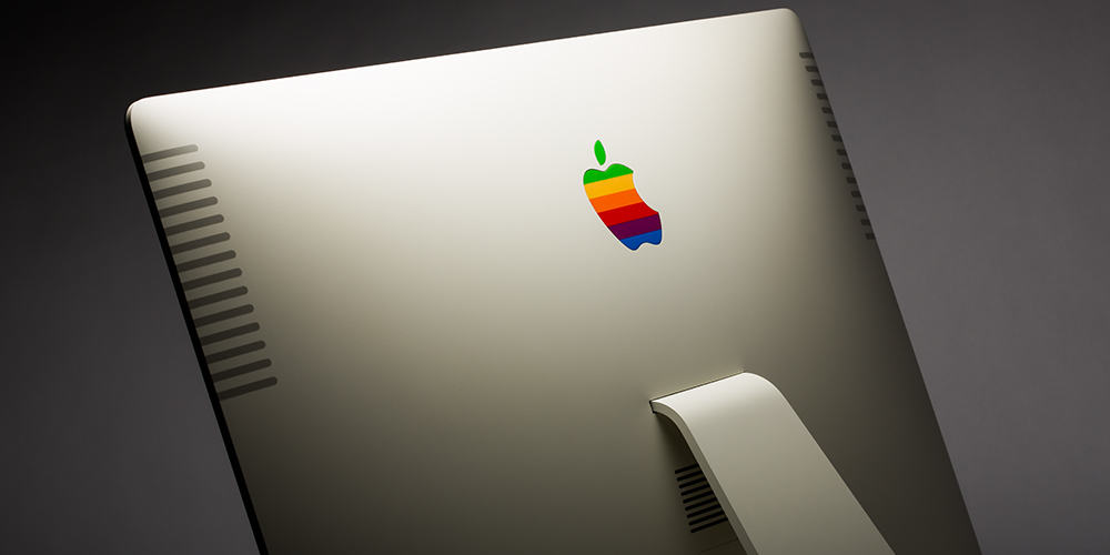 The rainbow Apple logo on the back of a modern iMac.