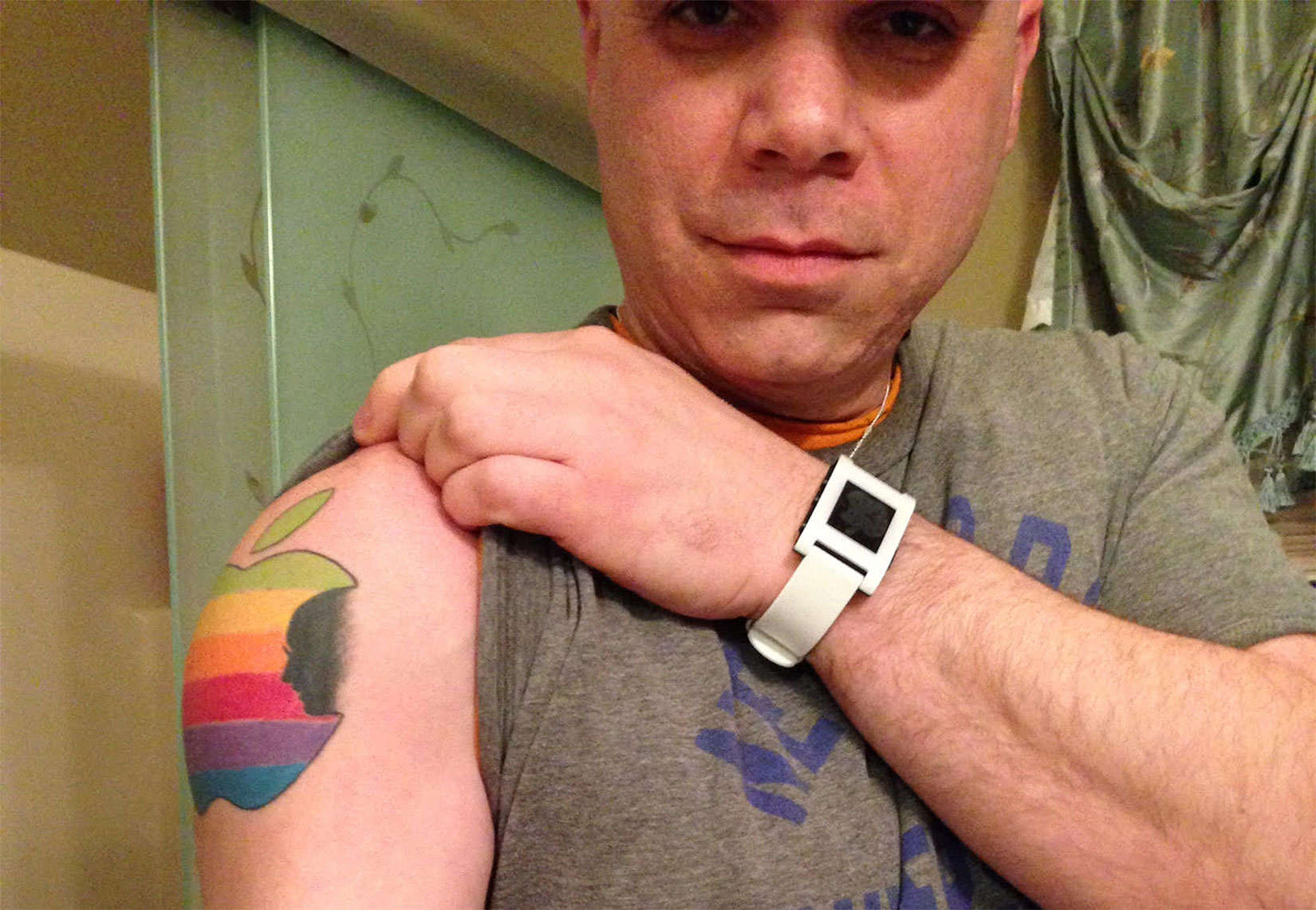 Craig Sarich with a Steve Jobs tribute design tattooed on his arm.