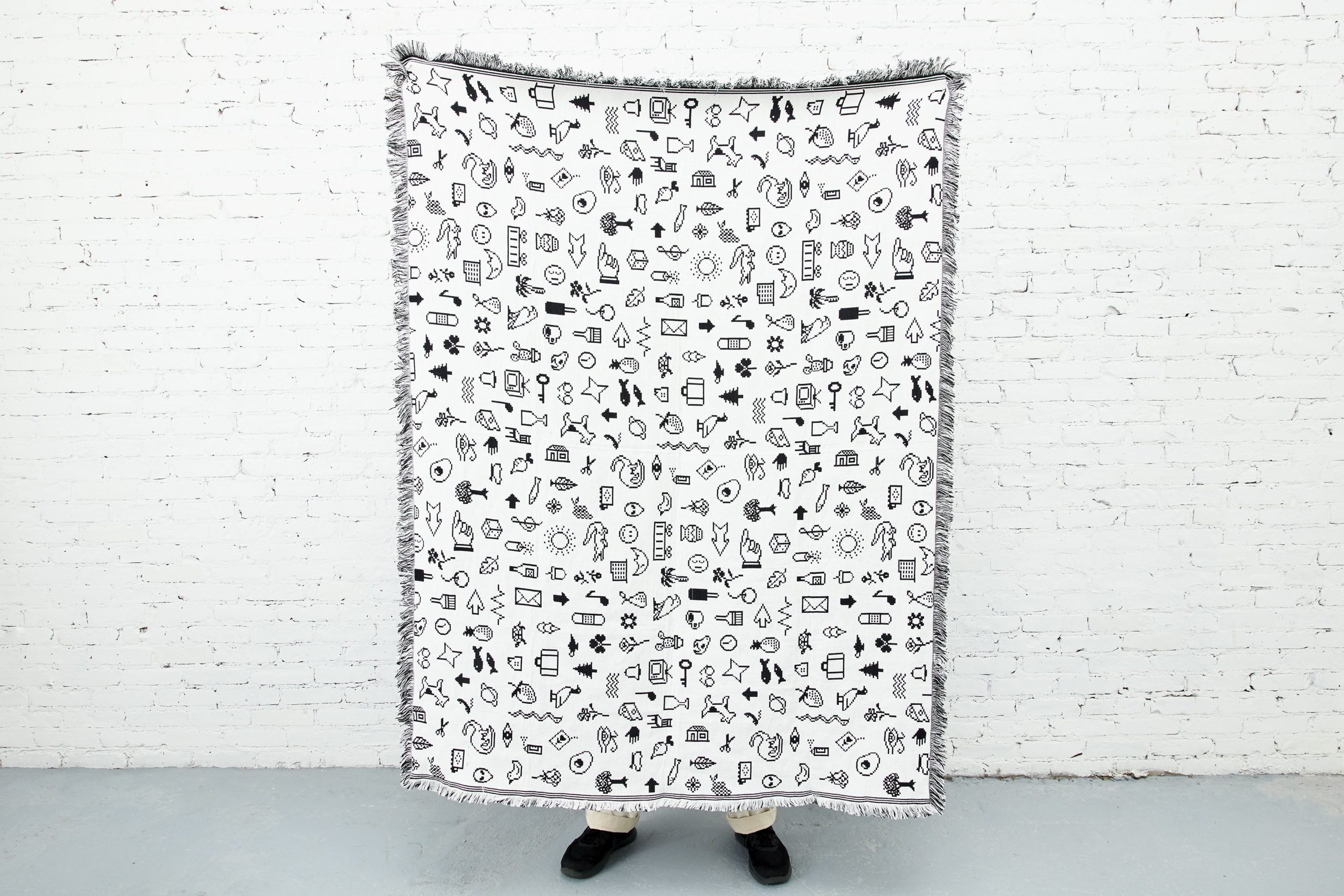 The designer of Apple’s iconic dingbats font recreates Cairo as a throw rug