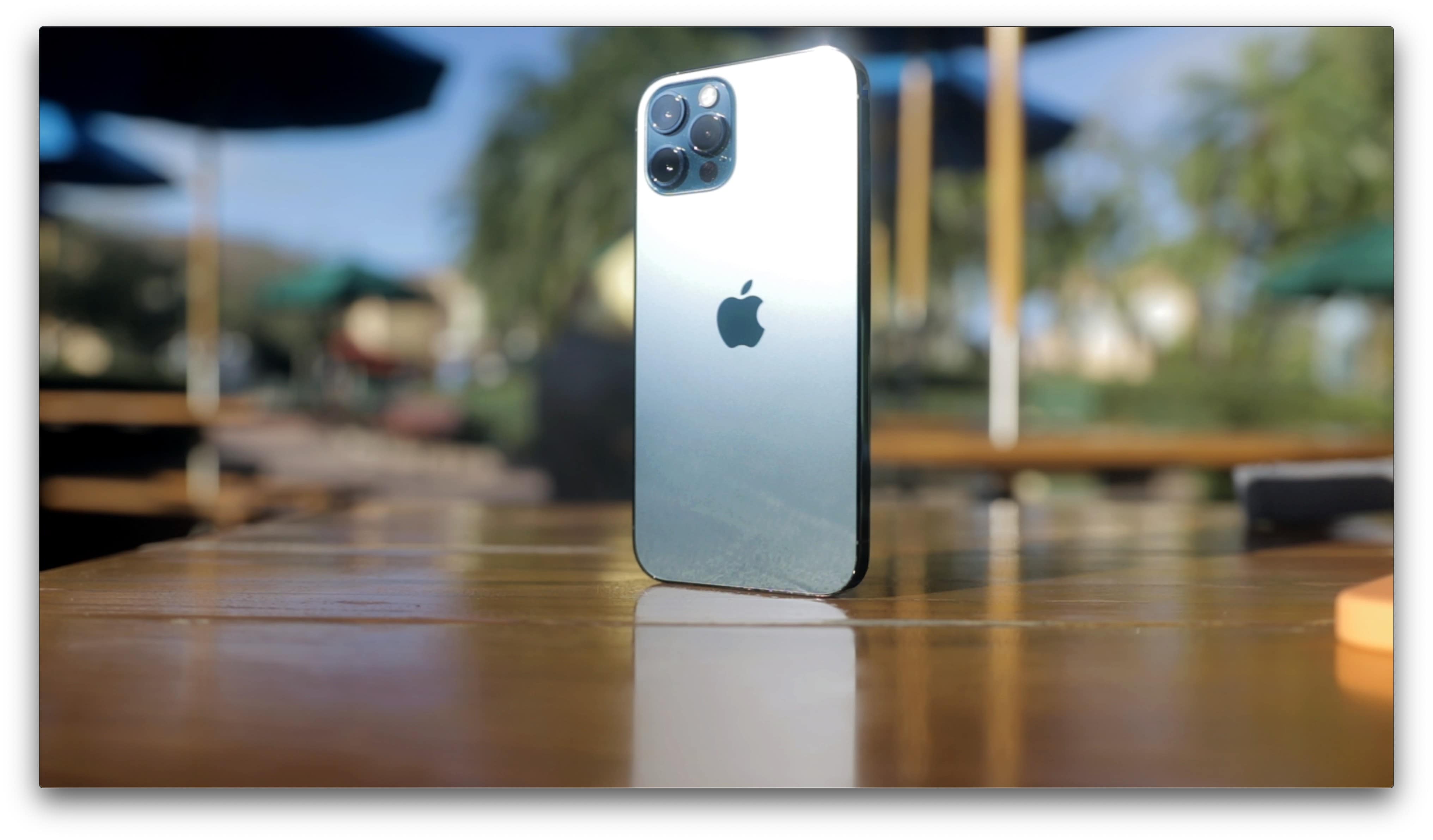 Pacific Blue iPhone 12 Pro on wooden table