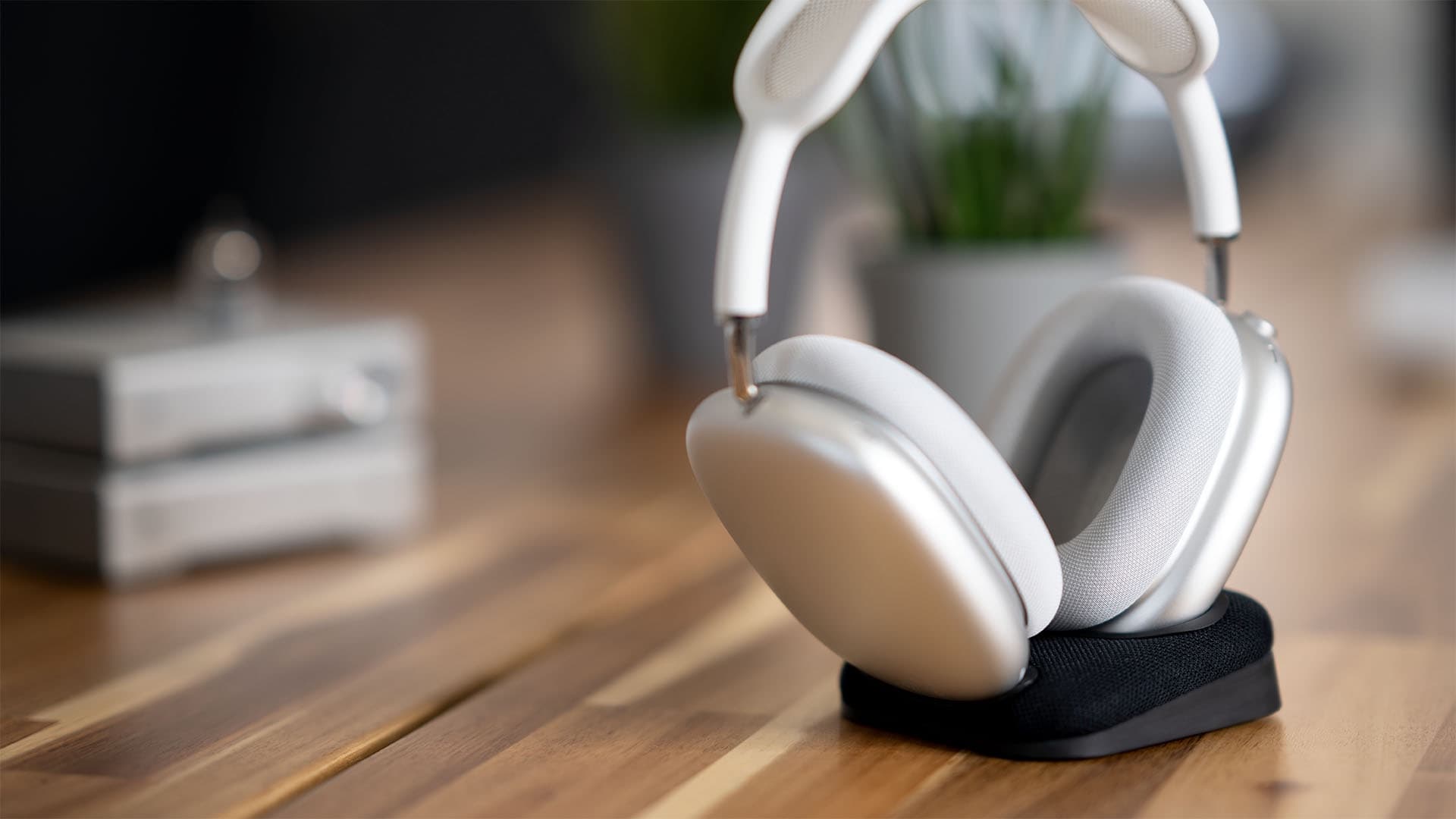 Max Stand holds and charges AirPods Pro.