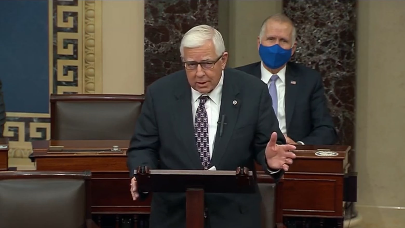 Senator Michael B Enzi says iPads and other electronic devices should be allowed on the Senate floor.