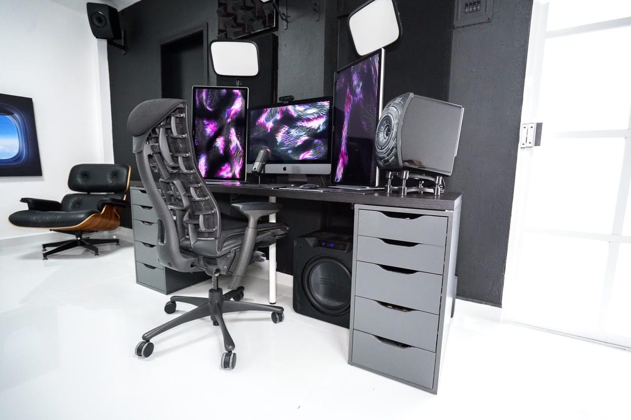 Christian Roman's setup is built for beautiful video and audio: 5K screens, massive subwoofer, pro lighting.