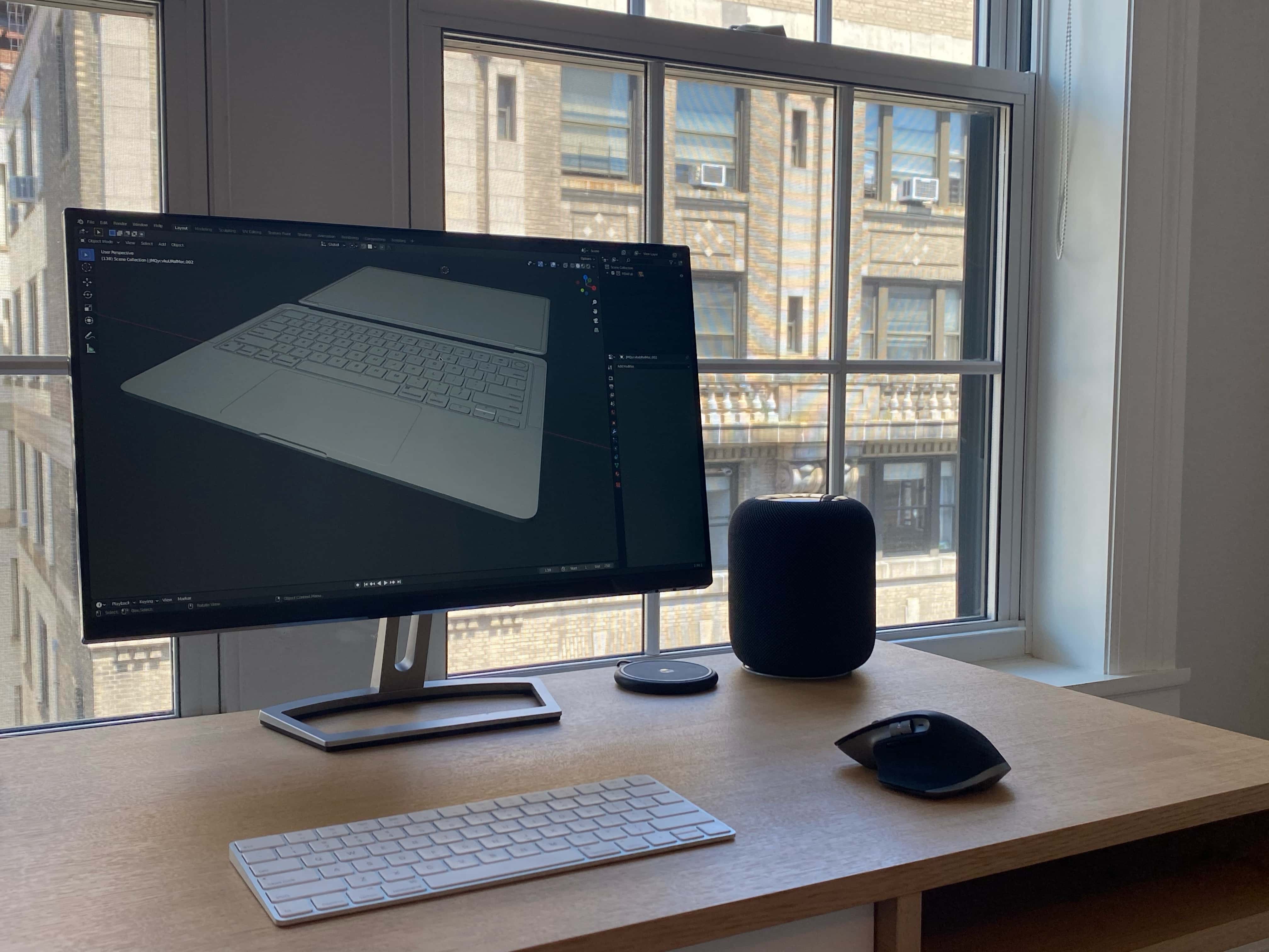 Ian Zelbo's monitor shows a render of a leaked MacBook Air concept he worked on with Jon Prosser. on.