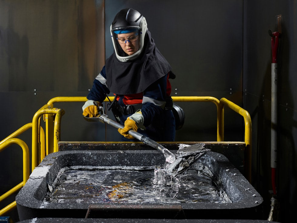 A worker inspects machinery at ELYSIS’s Industrial Research and Development Centre in Quebec.