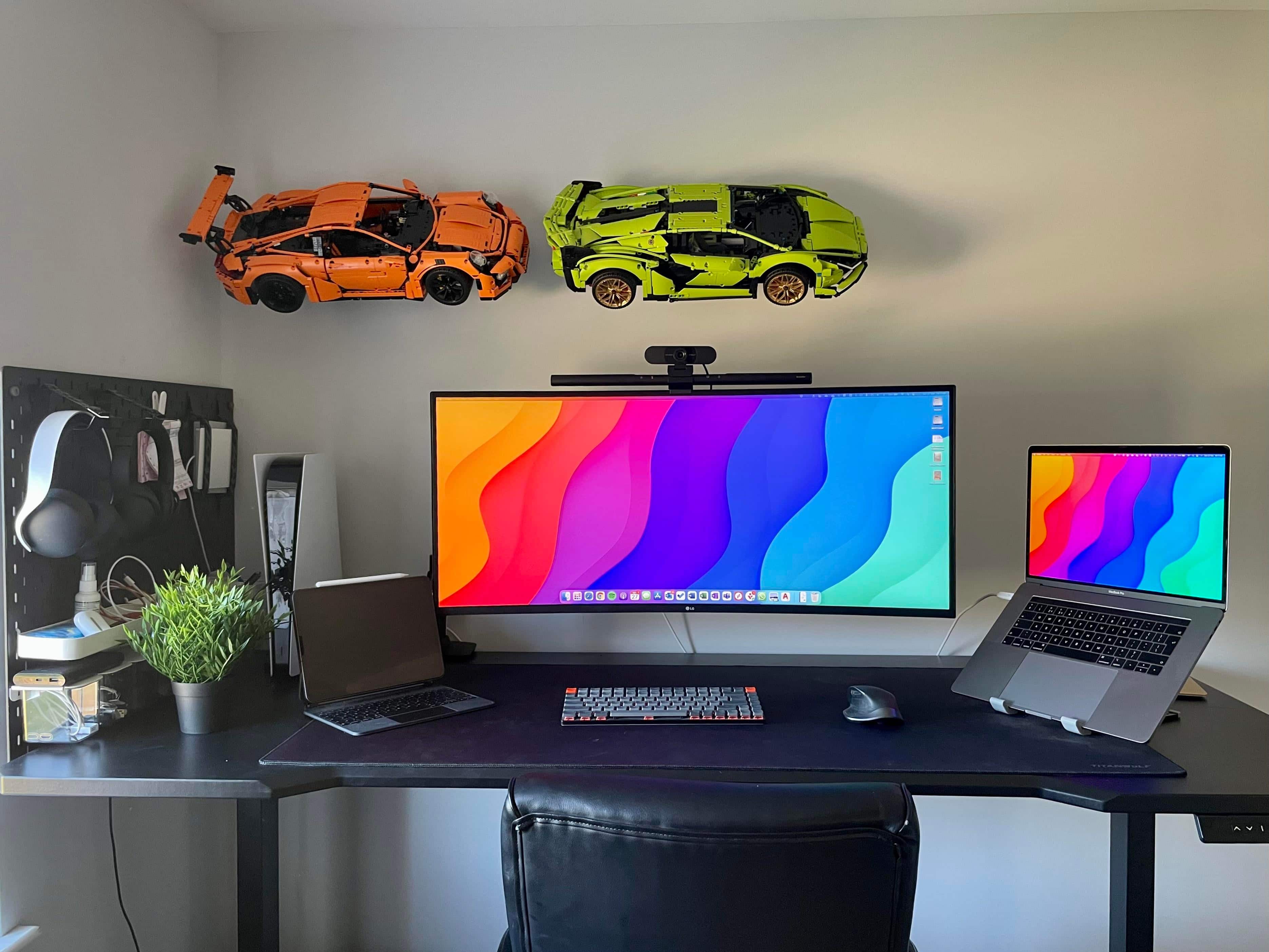 Those Lego Technic race cars flying across the wall in the back are almost as complicated as real cars.