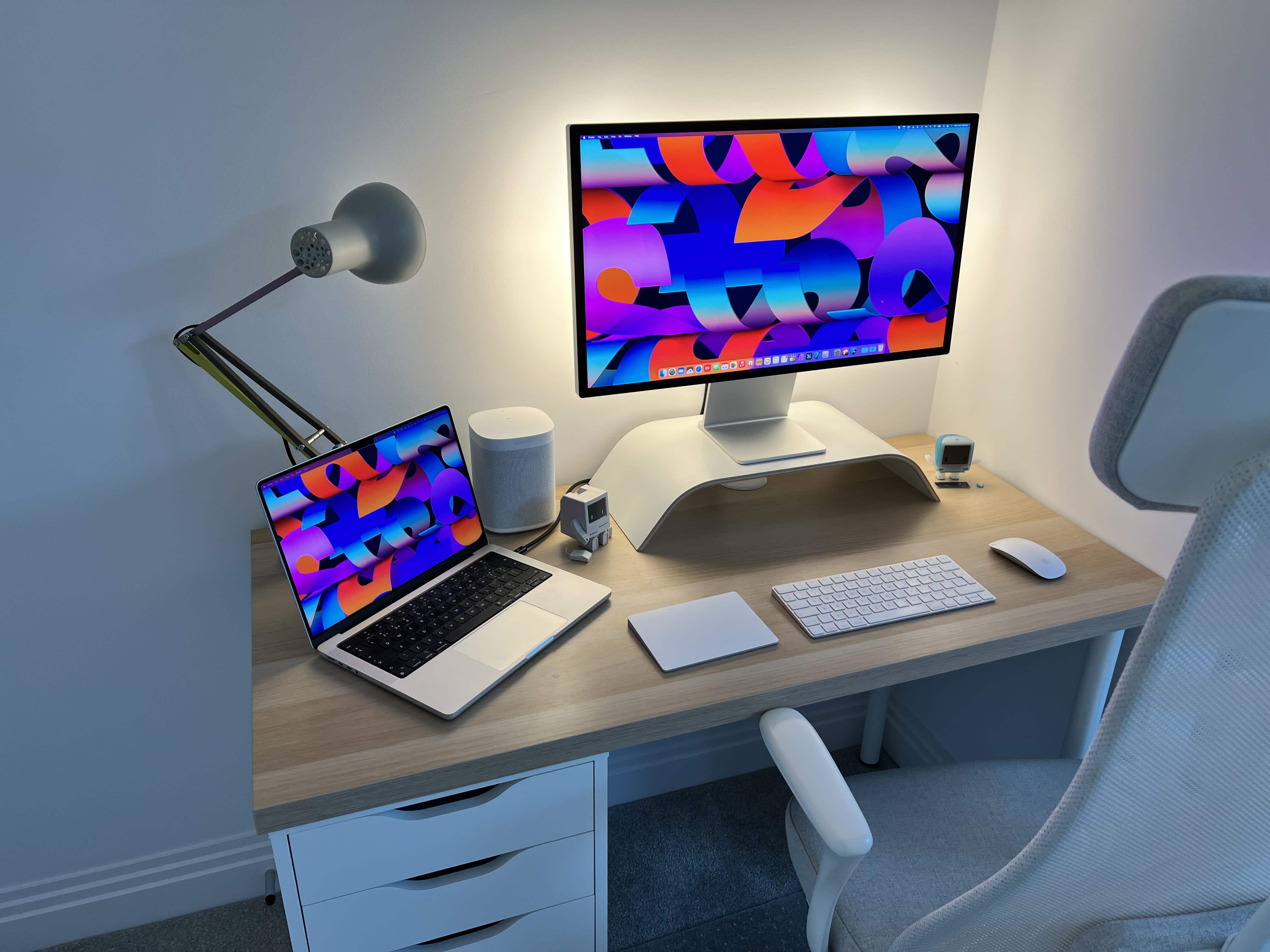 This cozy corner benefits from Philips Hue Play light bars behind the Studio Display.