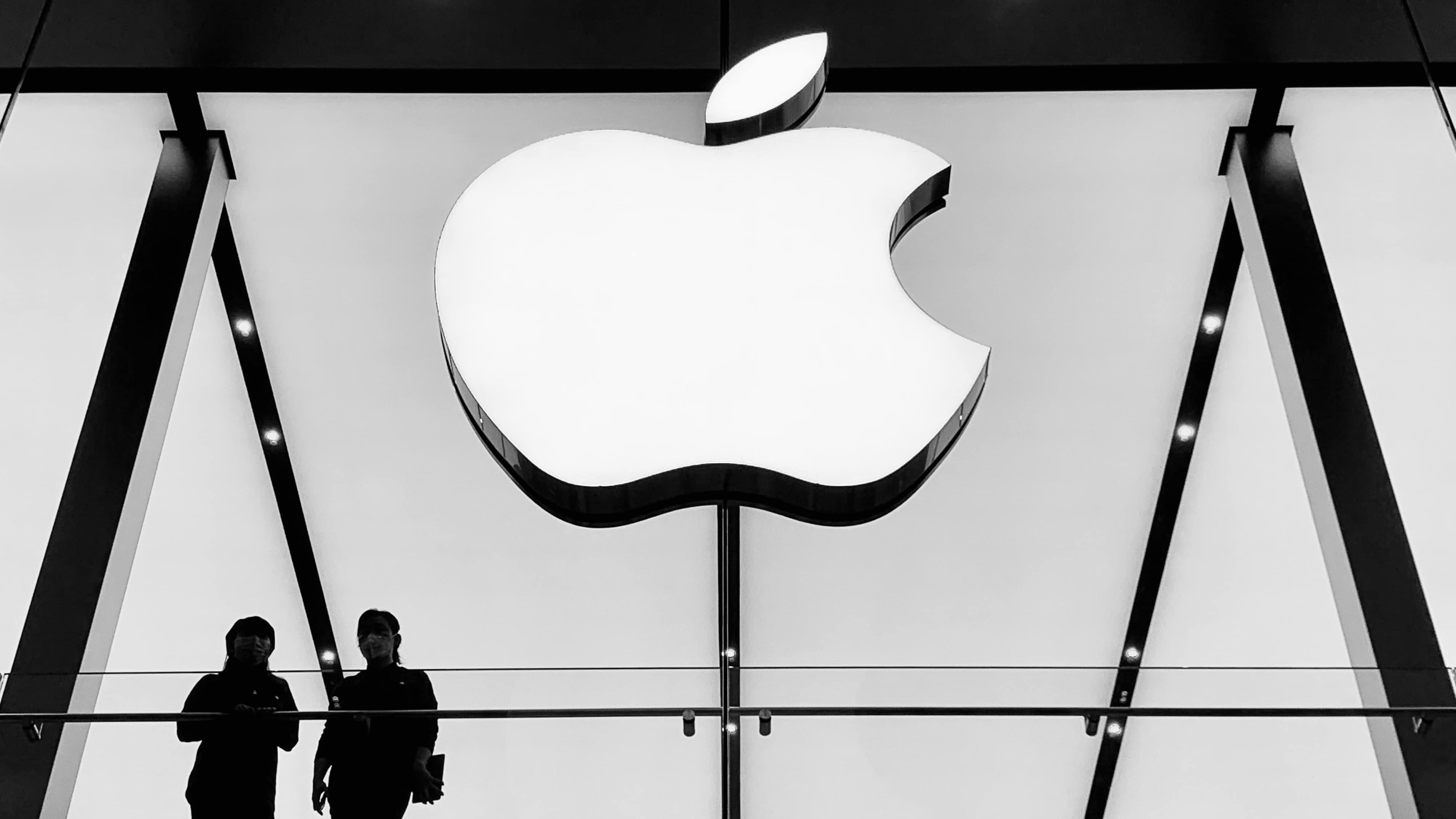 Apple Store logo in Chengdu, China with two people standing in front of it