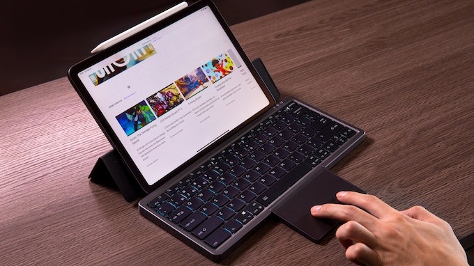 This portable folding keyboard sports hide-away trackpad