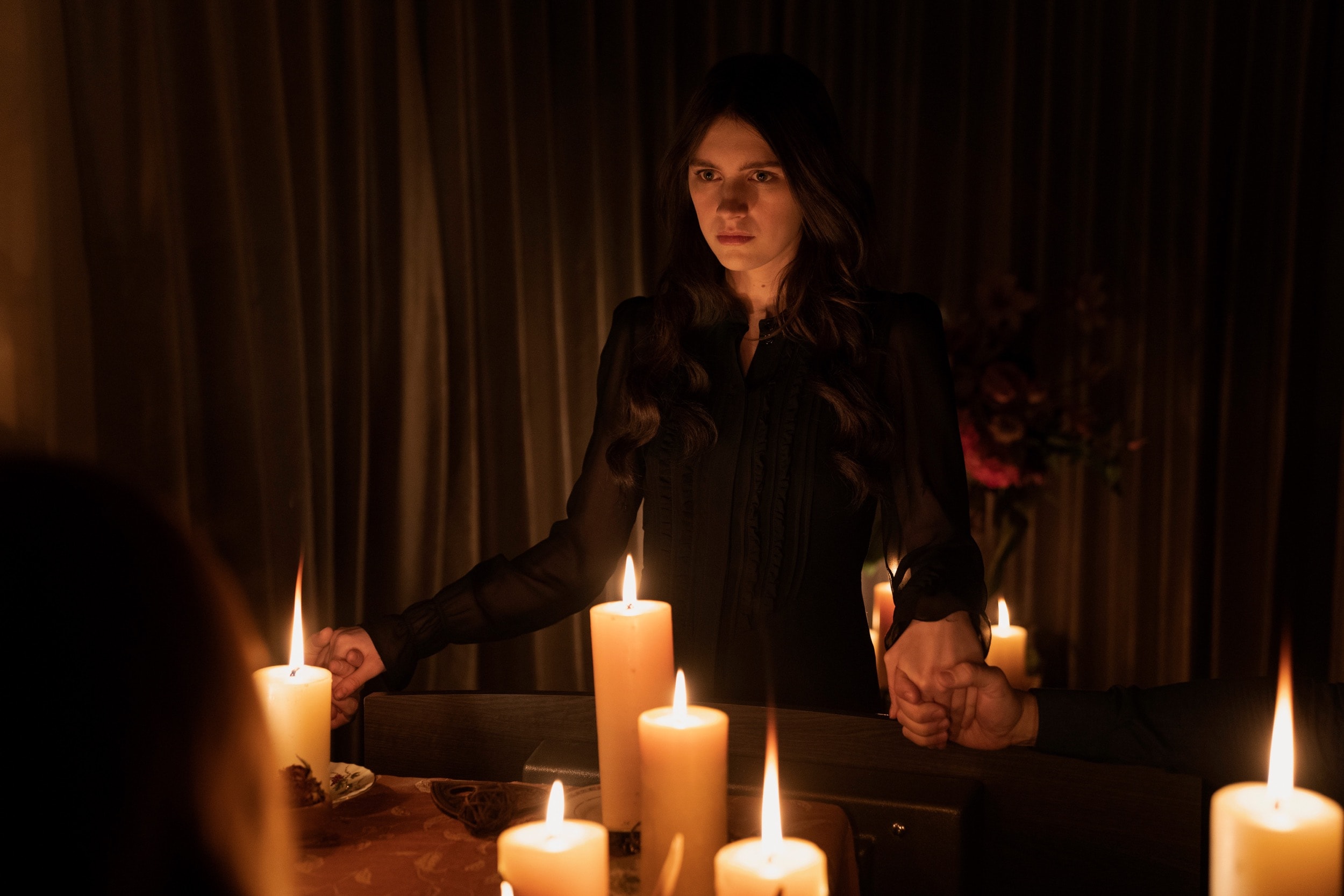 Leanne (played by Nell Tiger Free) in a seance scene from Apple TV+ chiller 