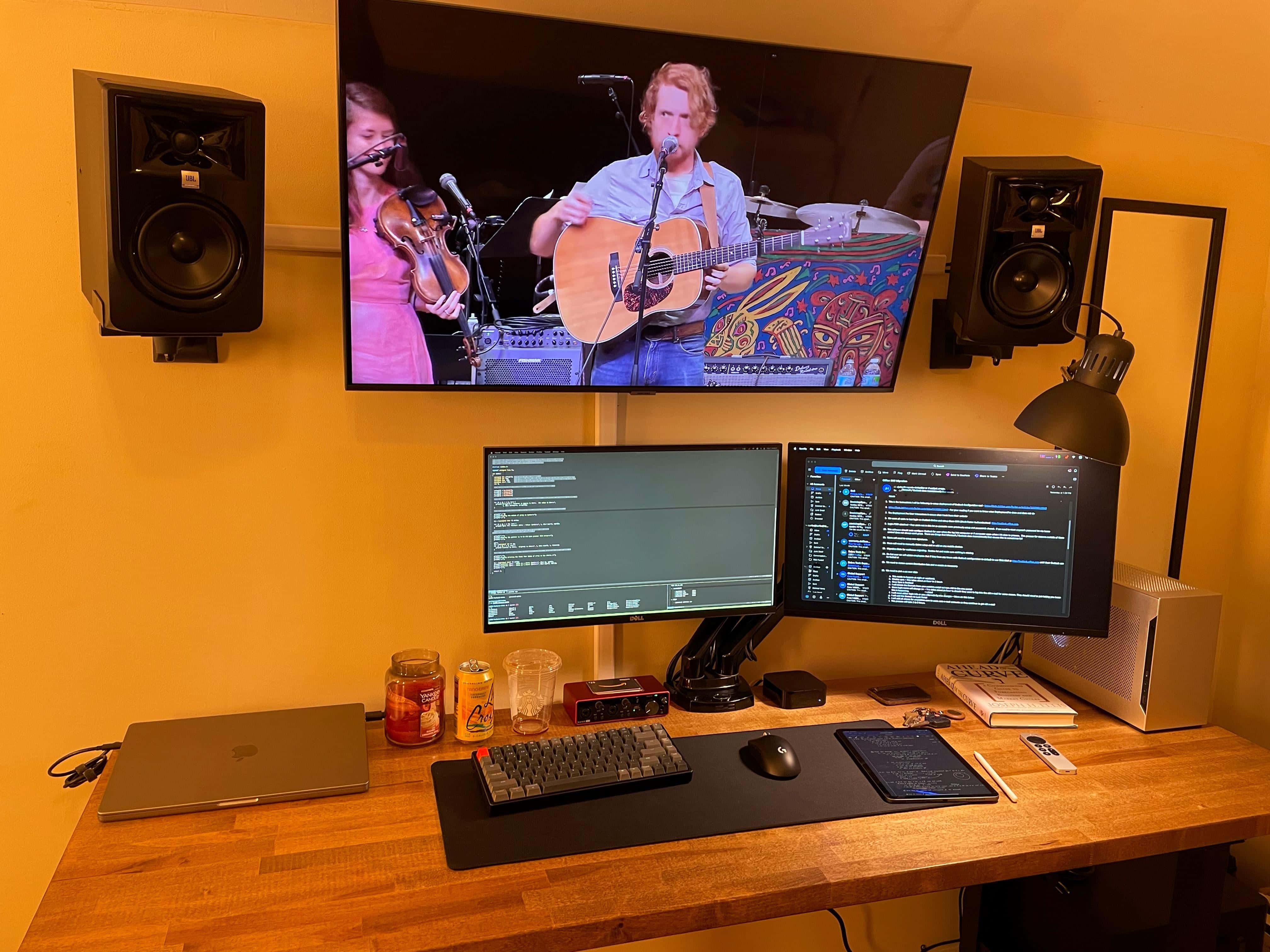 A wall mount lets the huge display sit up and behind the others.