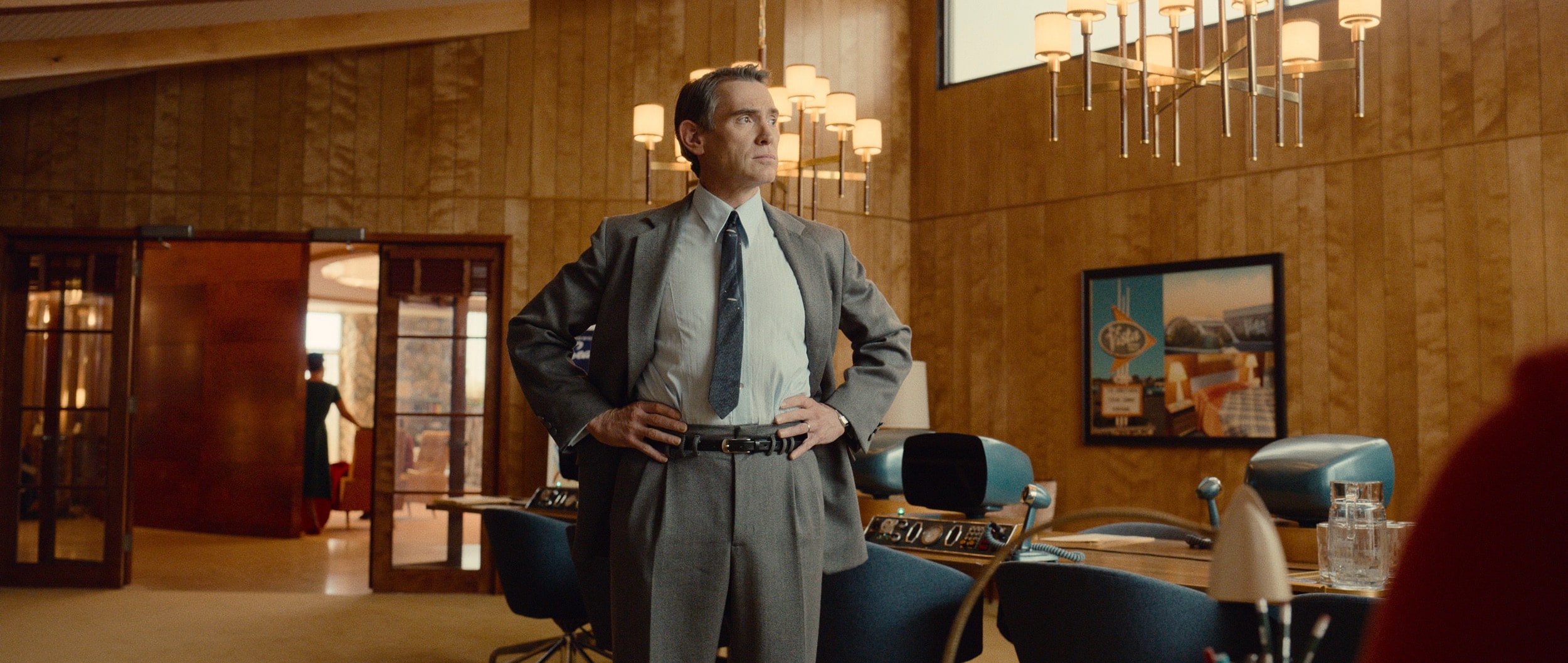 Billy Crudup stands in a retro-futuristic office in a scene from Apple TV+ show 