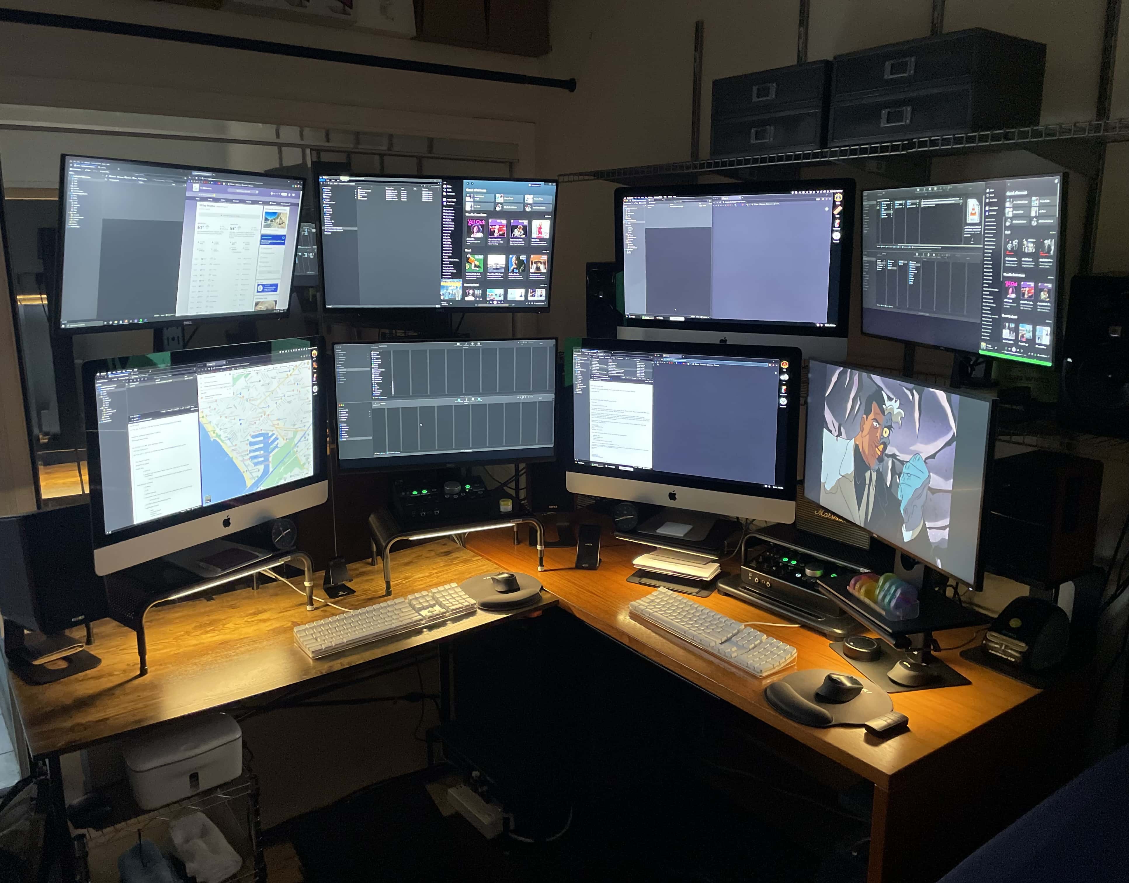 Three of the displays are iMacs and five are Dell 4K monitors.
