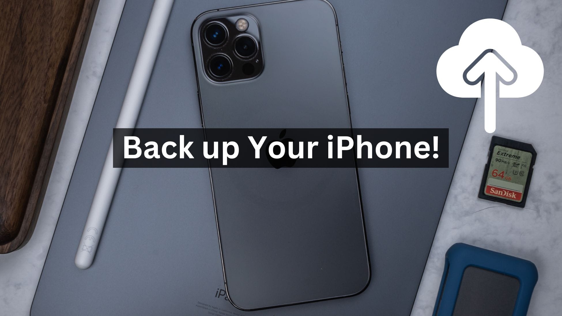 iPhone lying on silver iPad with Apple Pencil and AirPods