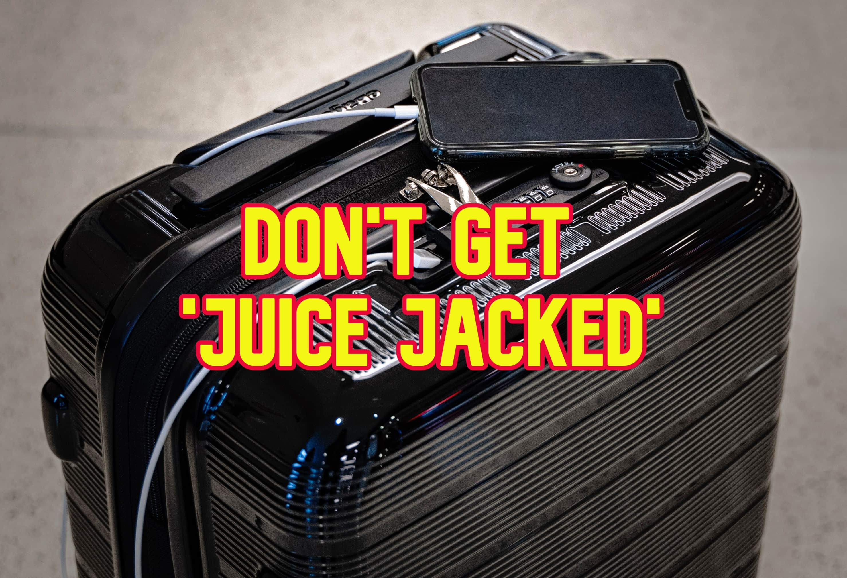 A suitcase with an iPhone charging on top and the words 