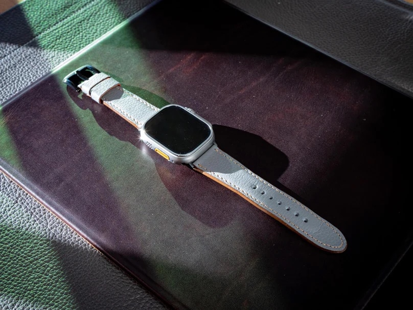 The fine gray leather band will develop a patina over years of use.