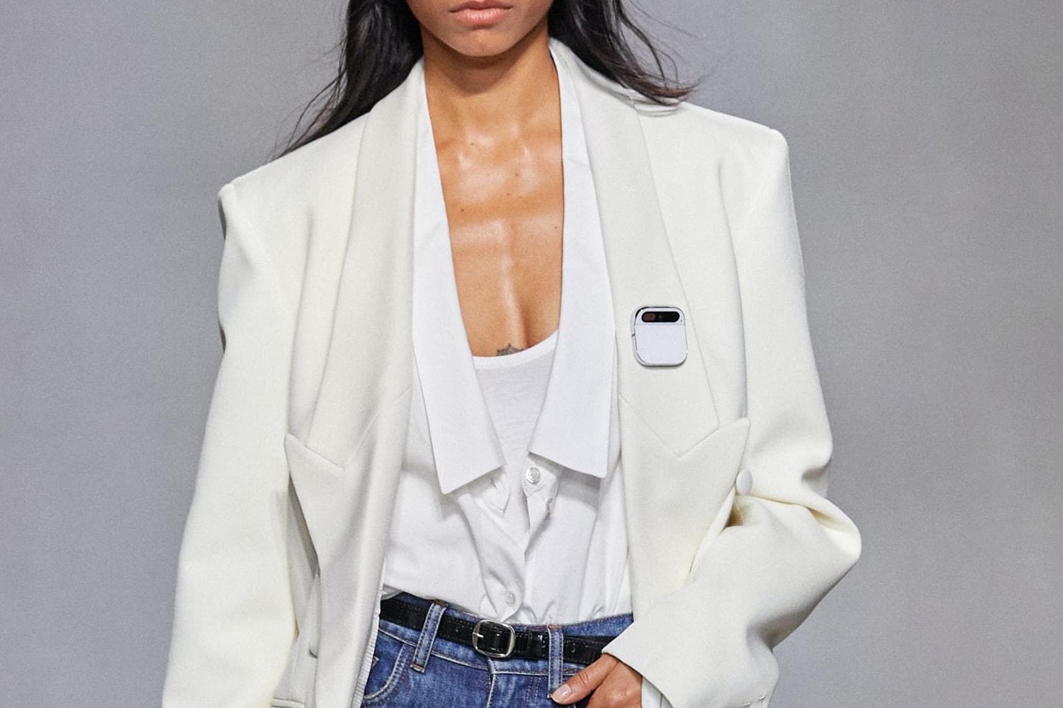 A runway model wearing Humane's Ai Pin.
