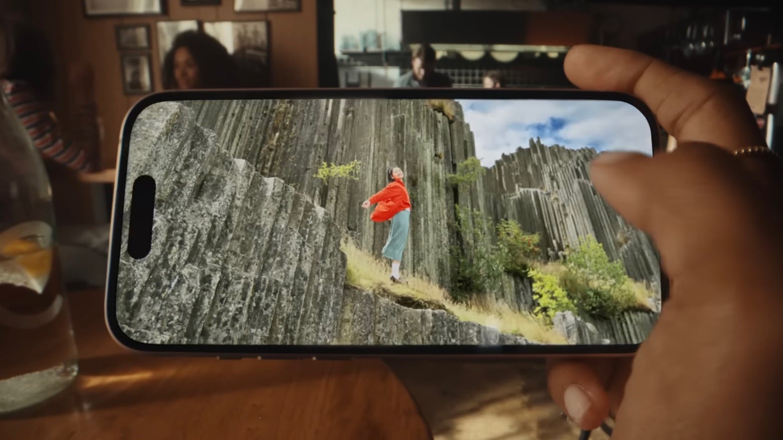 iPhone 15 in hand