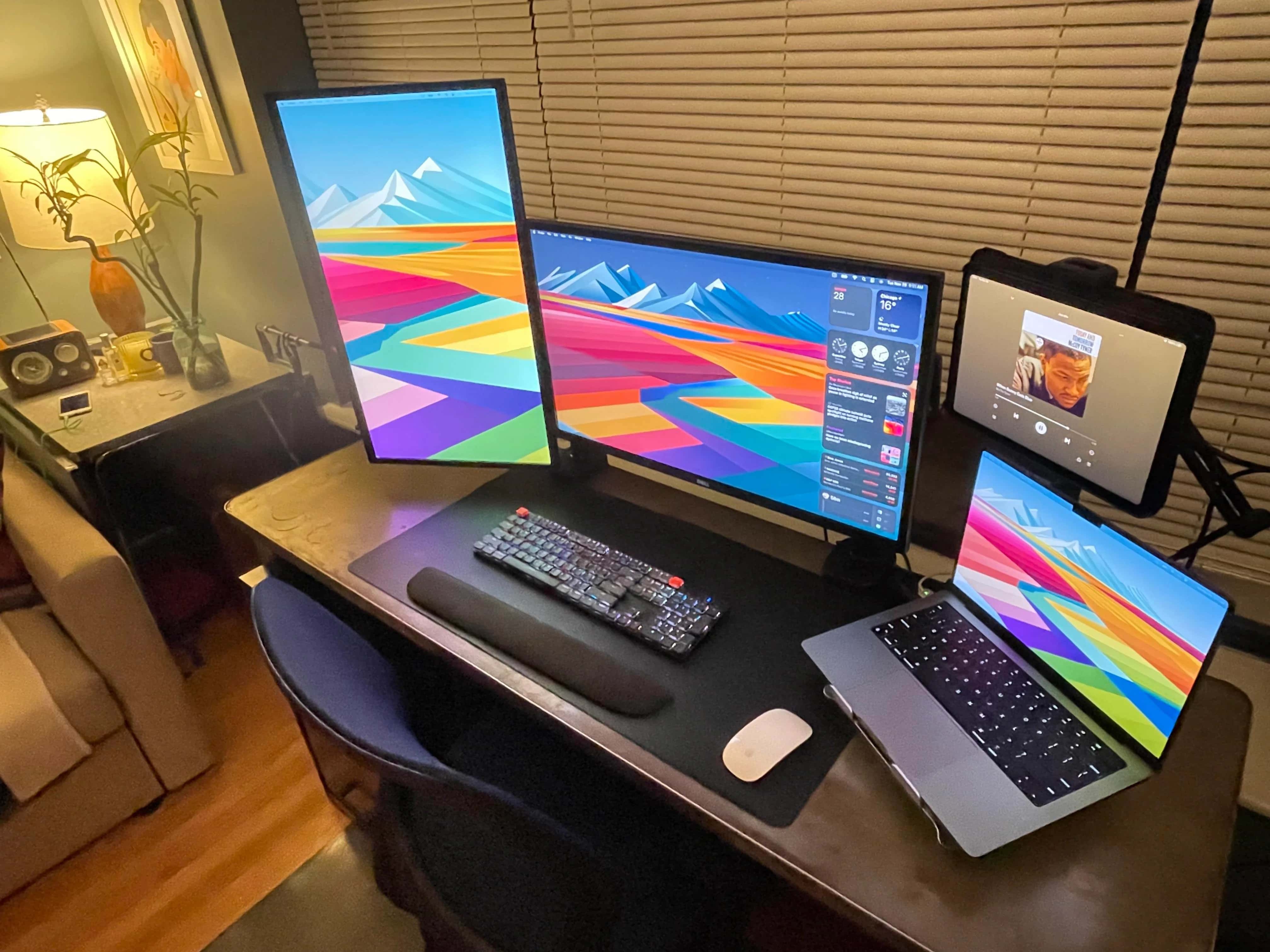 MacBook Pro setup with mounted devices and displays