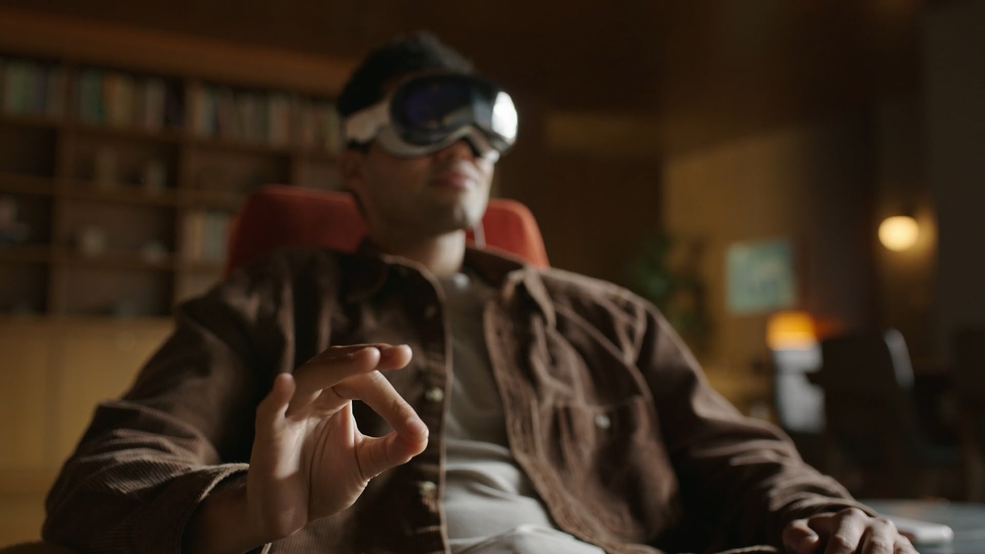 Man wearing Vision Pro tapping his fingers together