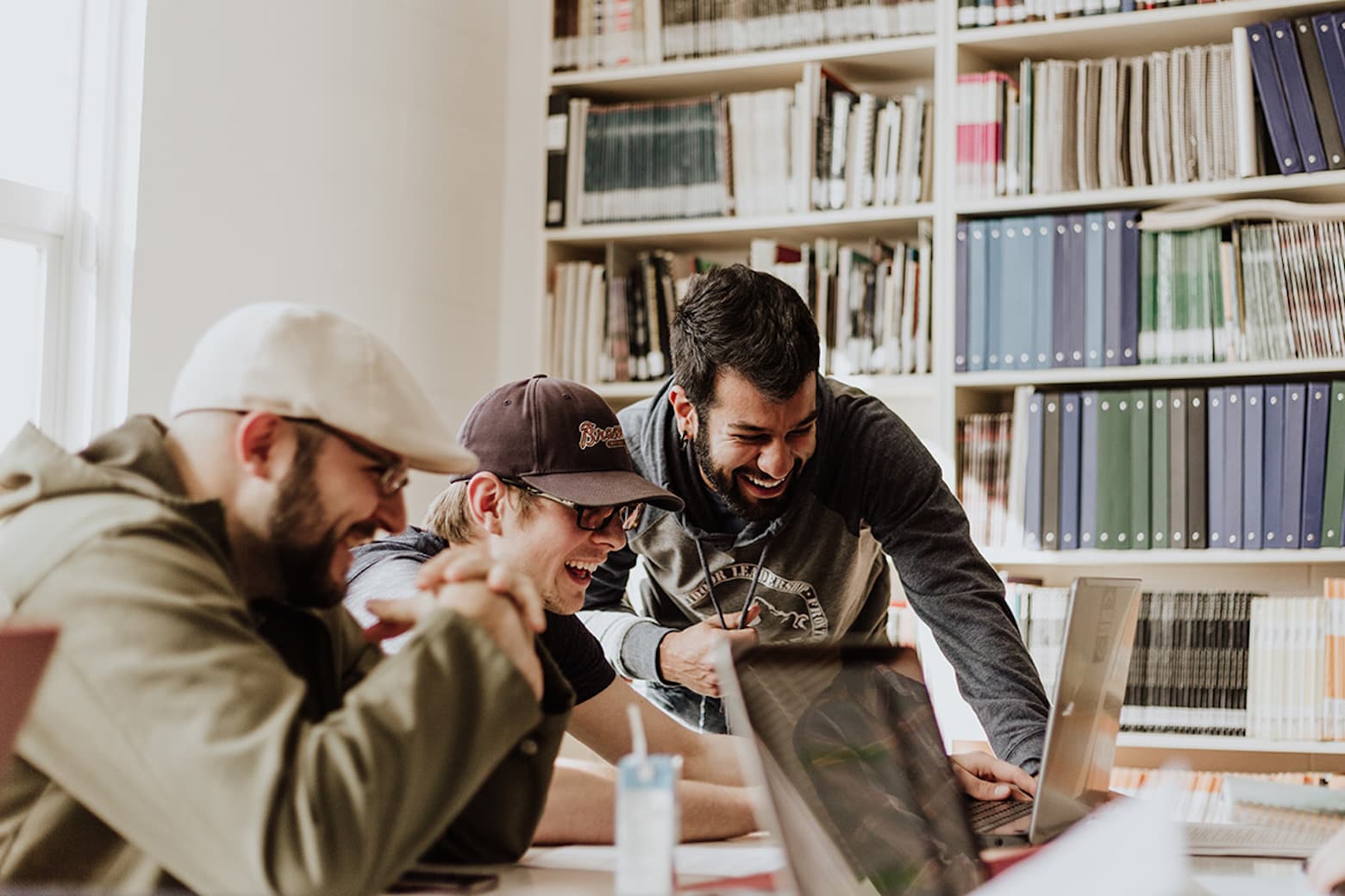 A photo of people using CompTIA study guides to get ready for IT certification exams.