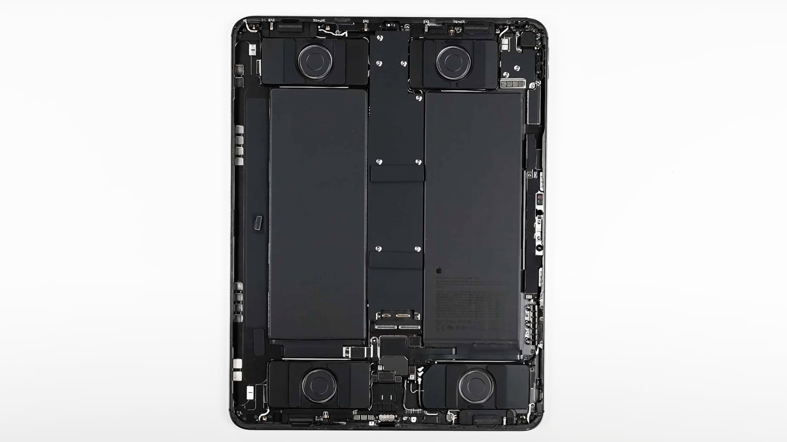 An M4 iPad Pro teardown shows the two batteries