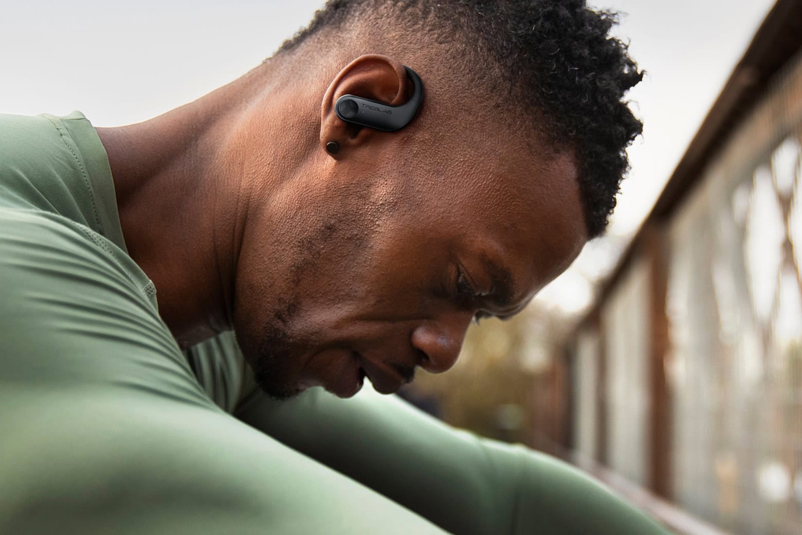Photo of a man working out wearing Treblab X3 Pro sweatproof workout earbuds.