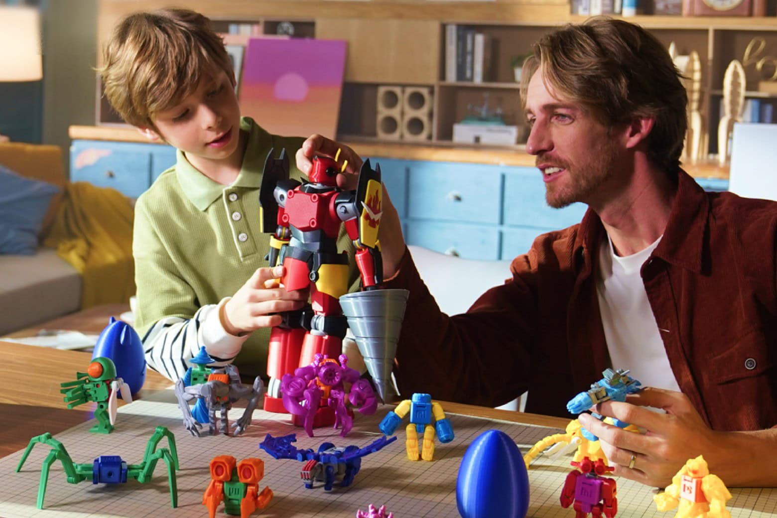 Father and son playing and learning about 3D printing with the X-Maker Joy 3D printer for beginners.