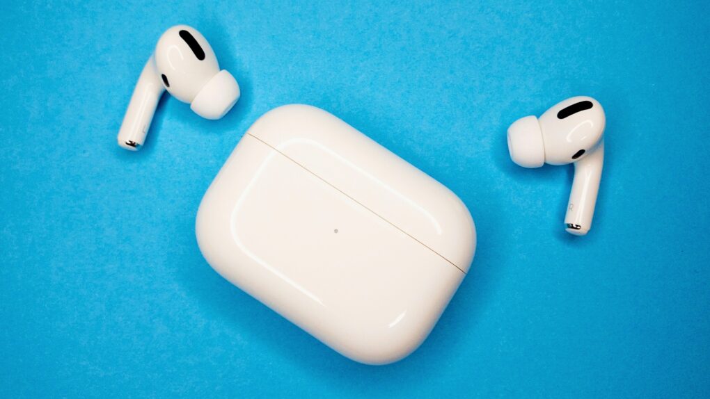 Photo of AirPods with case on a blue background, for a sell your AirPods offer