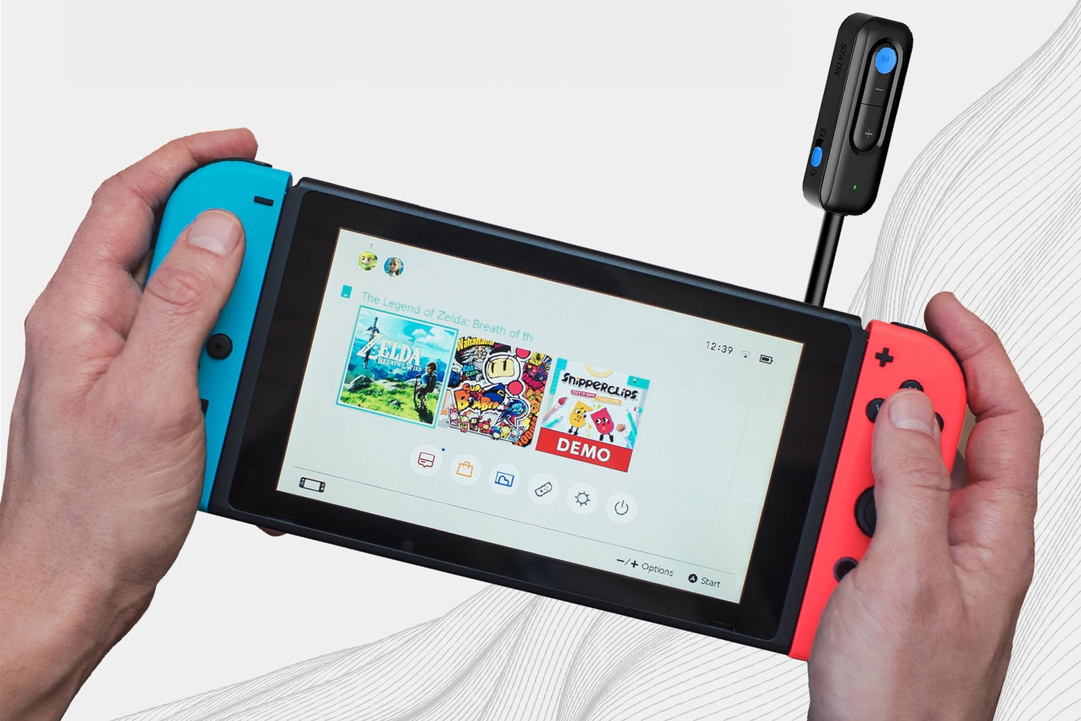 Man using his gaming device with the BlueSnap Bluetooth.