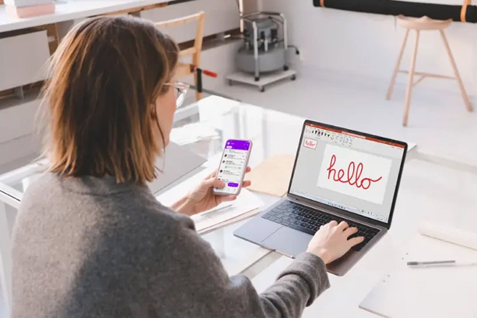 Woman using her laptop with one of Microsoft Office 2024 apps installed.