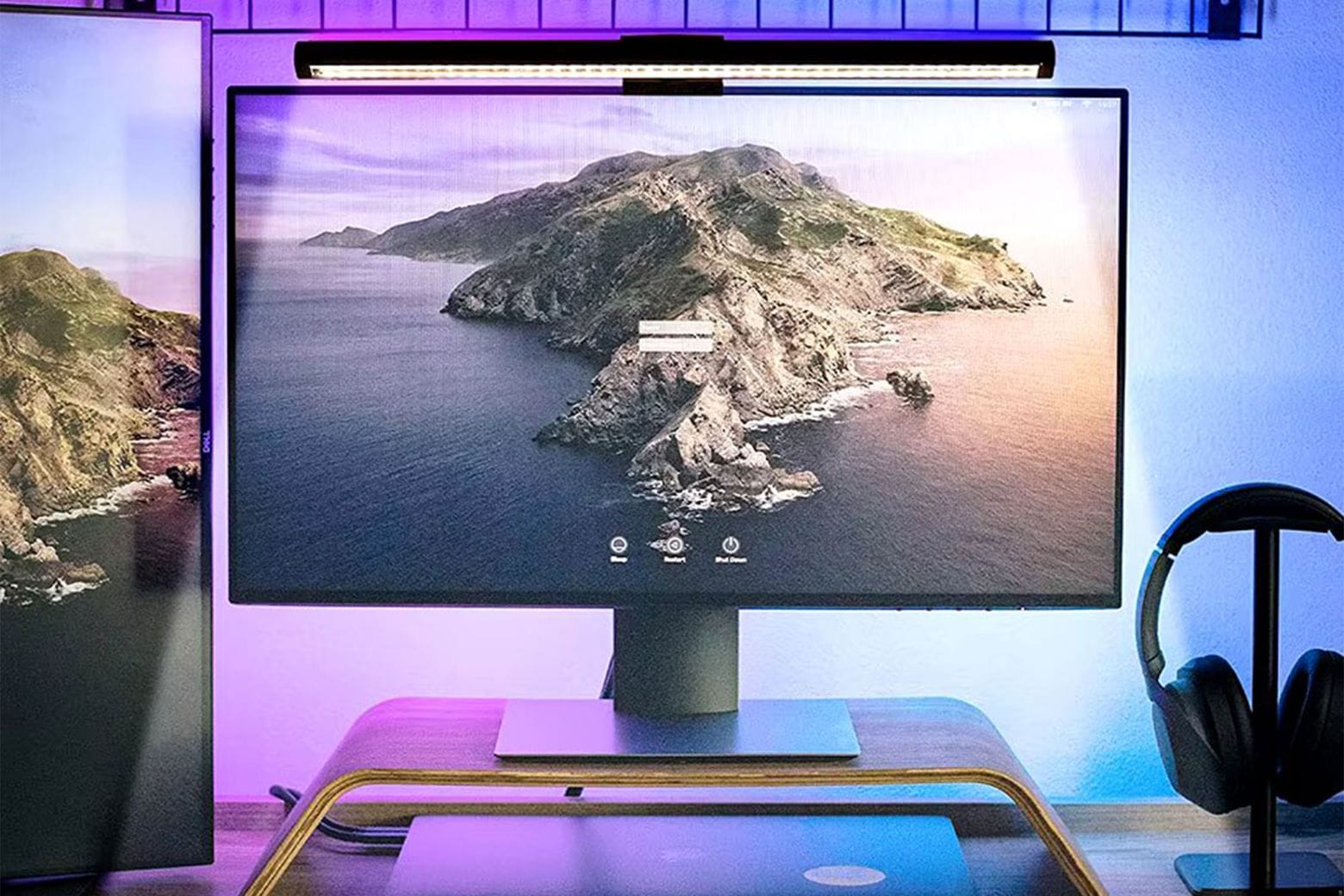 Product photo shows LED monitor light bar shining onto a monitor on top of a desk.