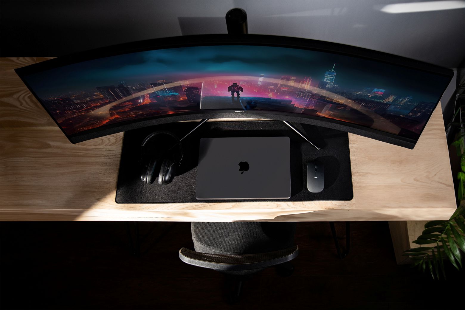 Illuminated curved gaming monitor on a desk