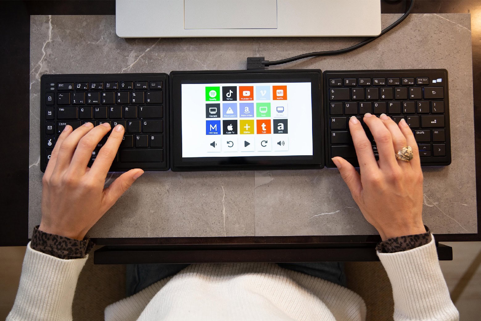 Photo of a person using a split ergonomic keyboard