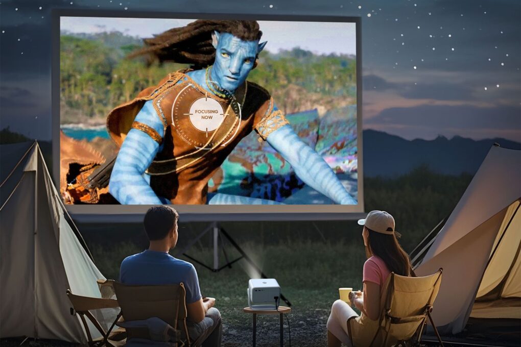 Watching a movie during a camping night through a portable projector
