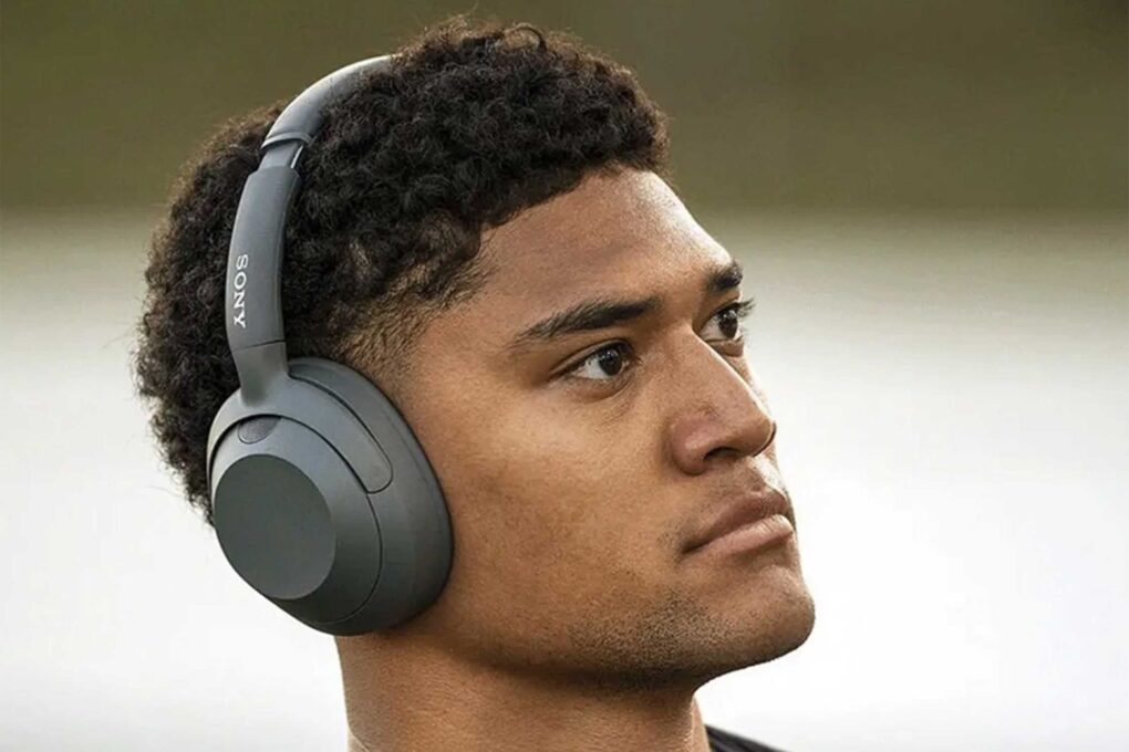 Photo of a man wearing Sony Ult Wear headphones