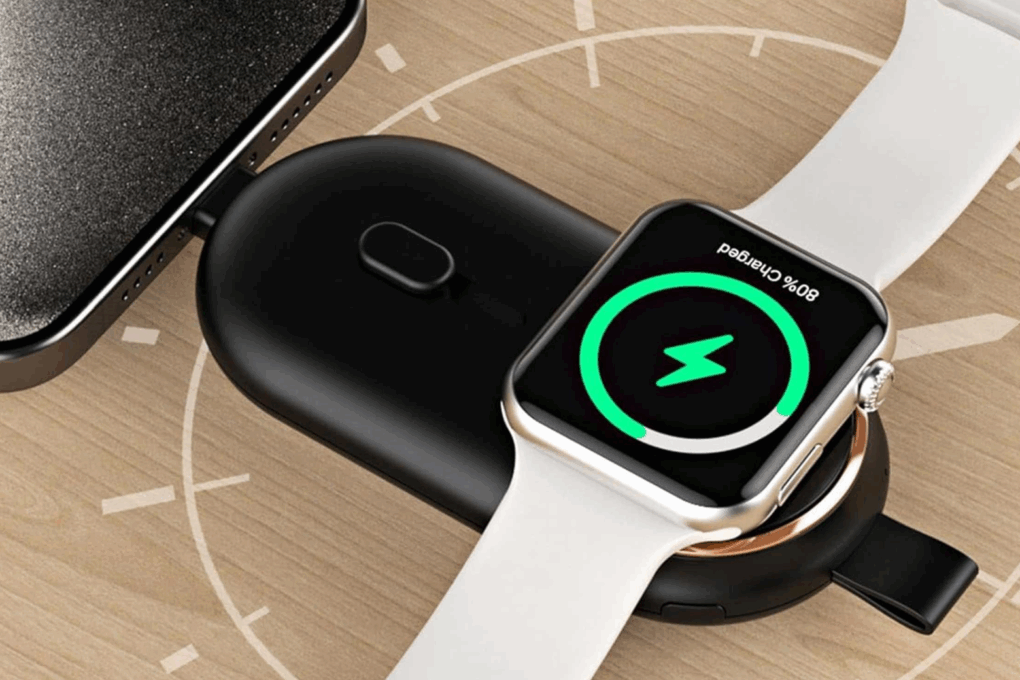 Photo illustration of a of Fob Charge keychain power bank charging up an iPhone and an Apple Watch